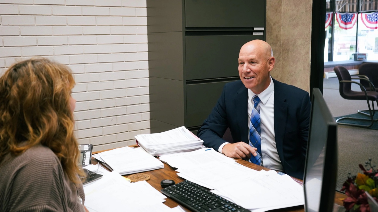 Brad Beekman meeting with a constituent at the bank